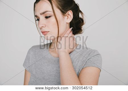 Close Up Picture Of Young Woman With Neckache Isolated.