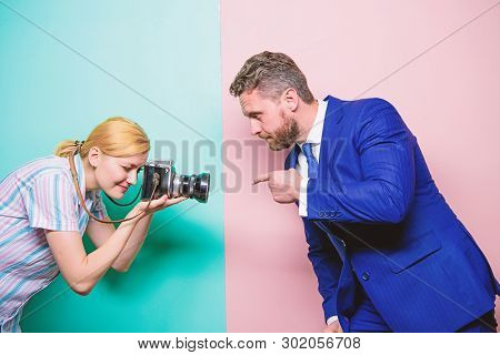 Ensuring That His Gesture Is Sharp And Focussed. Businessman Posing For Female Photographer. Fashion