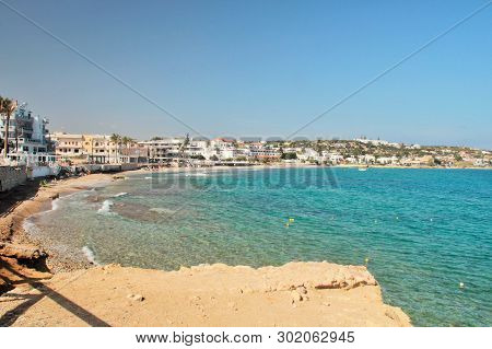 Beaches And Hotels Along The Coast. Resort City On The Mediterranean Sea, View Of The Beach And Hote