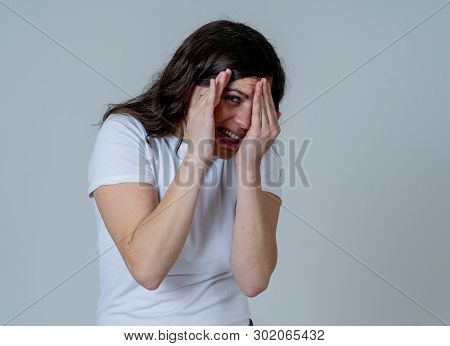 Young Woman Feeling Scared And Shocked Making Fear, Anxiety Gestures. Looking Terrified And Covering