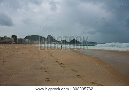 Rio De Janeiro: The Most Famous Beach, Copacabana Beach In Cloudy Weather. Brazil