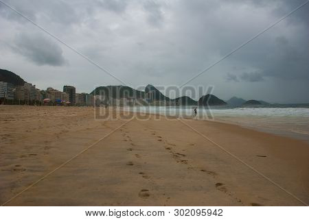 Rio De Janeiro: The Most Famous Beach, Copacabana Beach In Cloudy Weather. Brazil