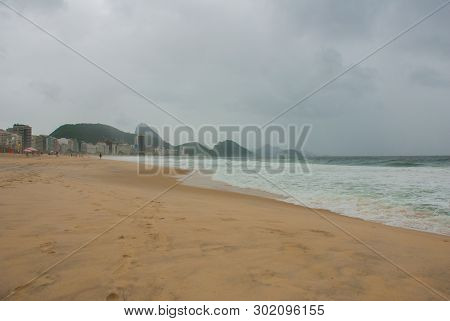 Rio De Janeiro: The Most Famous Beach, Copacabana Beach In Cloudy Weather. Brazil