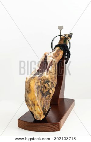 Spanish Delicatessen Dry Cured Meat Ham, Whole Leg, Jamon Iberico Bellota On Jamonero Stand Selectiv