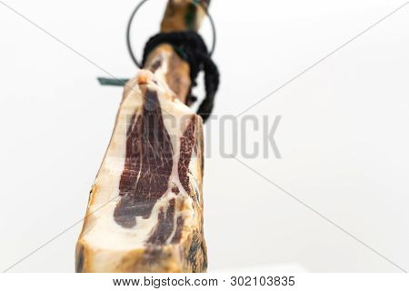 Spanish Delicatessen Dry Cured Meat Ham, Whole Leg, Jamon Iberico Bellota On Jamonero Stand Selectiv