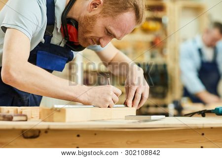 Cropped Portrait Of Contemporary Carpenter Working With Wood Standing At Table In Workshop, Copy Spa