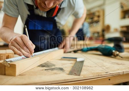 Mid Section Portrait Of Unrecognizable Carpenter Working With Wood Standing At Table In Workshop, Co