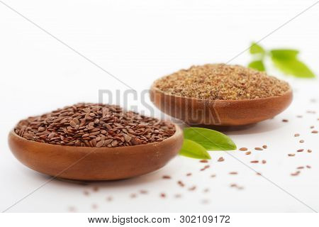 Flax Seed And Grinded Flaxseed In Wooden Bowls - Linum Usitatissimum. Healthy Food.