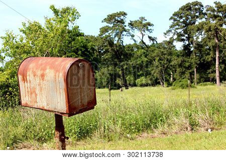 Rusty, Old Mail Box On A Lot In A Rural, Country Setting