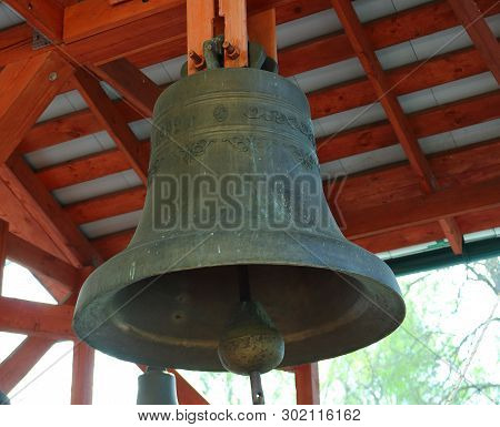 Zaraysk, Russia - 1 May, 2019: Russian Church Bell Hanging Outside In The Wooden Belfry Of The Zarai