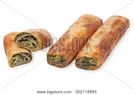 Baking Puff Pastry With Spinach And Greens, One Pastry In The Cut. Isolated On White Background