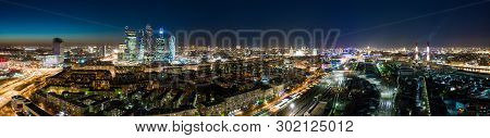 High-rise Buildings And Transport Metropolis, Traffic And Blurry Lights Of Cars On Multi-lane Highwa