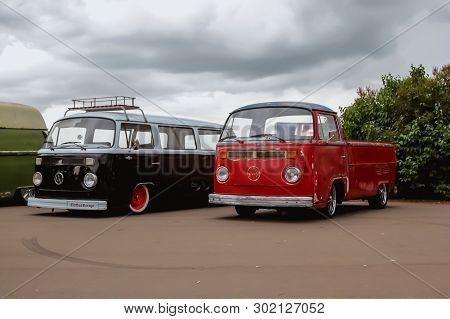 Moscow. Russia - May 20, 2019: Red And Black Legendary Volkswagen Transporter T2 Are Parked On The S