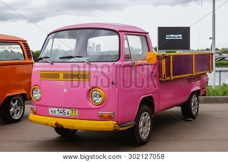 Moscow. Russia - May 20, 2019: Pink And Yellow Volkswagen Transporter T2 Pickup Hippie Bus Are Parke