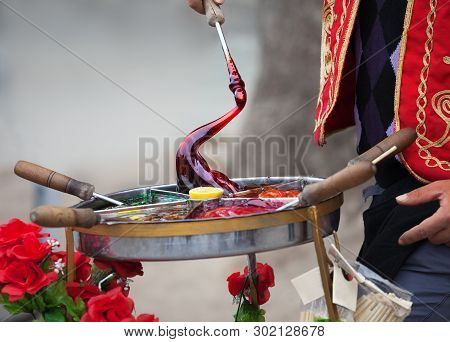 Macun - Soft, Sweet And Colorful Turkish Toffee Paste In Traditional Container. Cooking Street Food 