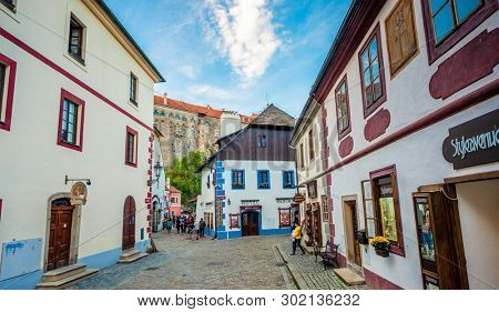 Krumlov, Czech Republic - 21 September 2018: View of Cesky Krumlov narrow street with beautiful ancient arcitecture and tourists