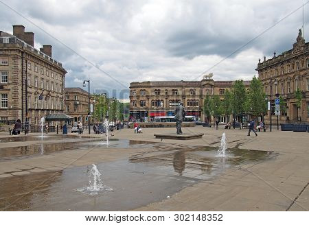 Huddersfield, Yest Yorkshire, United Kingdom - 20 May 2019: People Walking In St Georges Square In H