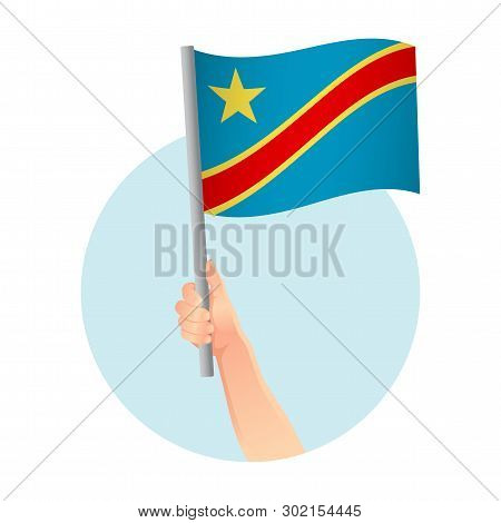 Democratic Republic Of The Congo Flag In Hand. Patriotic Background. National Flag Of Democratic Rep