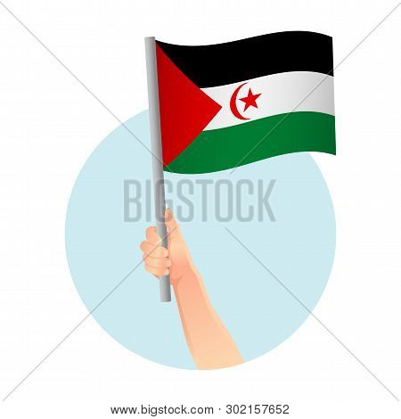 Sahrawi Arab Democratic Republic Flag In Hand. Patriotic Background. National Flag Of Sahrawi Arab D