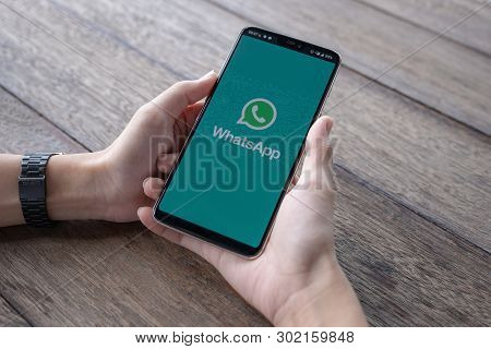 Chiang Mai, Thailand - May 11 2019 : Man Holding A Oneplus 6 And Open Appstore Searching Social Inte