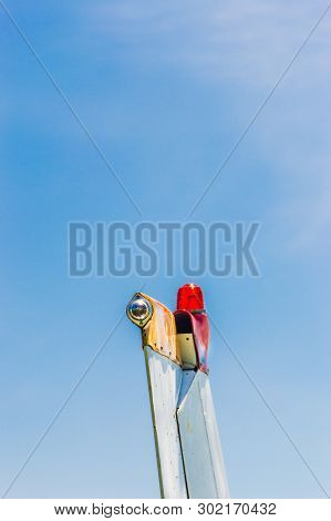Tail Fin, Rudder And Beacon Lights, Small Single Engine Airplane With Old Paint And Bright Blue Sky.
