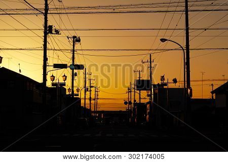 Silhouette Electric Pole And Cable Over The Dramatic Sunset, Japan.