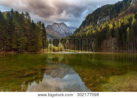 View Of Mount Skuta. Plansar Lake Or Plansarsko Jezero On Valley Zgornje Jezersko In Autumn. Norther