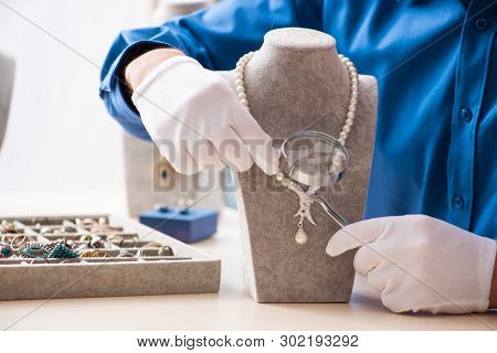 Young jeweler working in his workshop