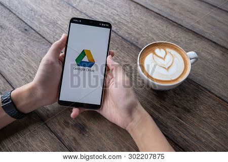 Chiang Mai, Thailand - May 11, 2019 : Male Hands Holding Oneplus 6 With Google Drive Apps On Screen.