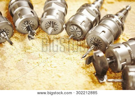 Woodworking Bits For Router Machine On Sawdust.