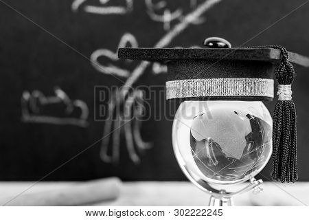 Education Graduation Celebrating Cap On Australia Crystal Glass Globe With Blackboard In Classroom F