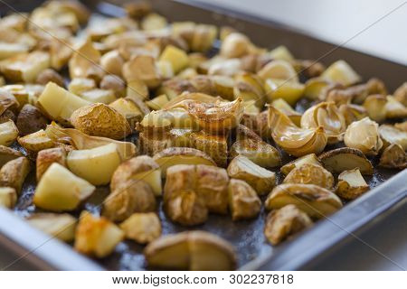 Roasted Potatoes Close Carlic Clovesin The Trey