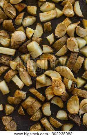 Roasted Potatoes Close Carlic Clovesin The Trey