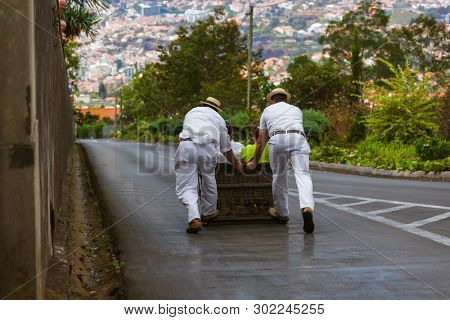 Toboggan riders on sledge in Monte - Funchal Madeira island - Portugal