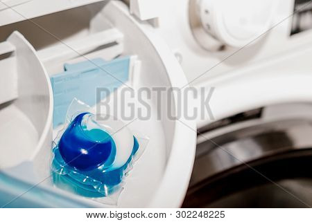 Laundry Blue Capsule In A Washing Machine