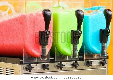 Close Up Of Slush Machine. Slushy Ice Made Colorful Drink Refreshing During Summer