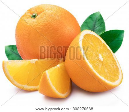 Orange fruit with orange slices and leaves isolated on white background.