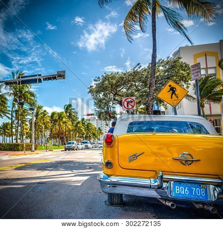 Miami Beach, Usa - February 26, 2019: Yellow Oldsmobile Rocket 88 Parked On World Famous Ocean Drive