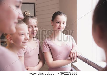 Young Graceful Female Ballet Dancers Dancing At Training Studio. Beauty Of Classic Ballet. Girls Res
