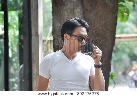 Unaware Man Or A Man Is Drinking Coffee
