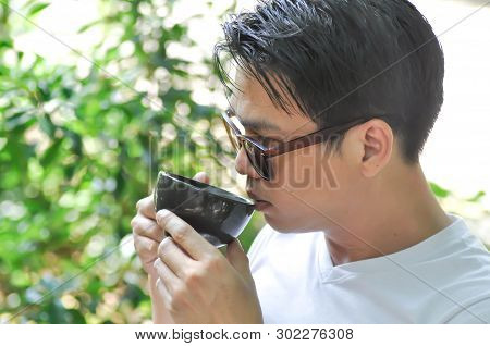 Unaware Man Or A Man Is Drinking Coffee