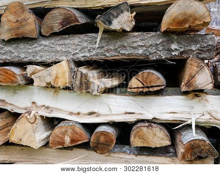 Stack Of Beech And Poplar Firewood For The Cold Season Close Up Shot.