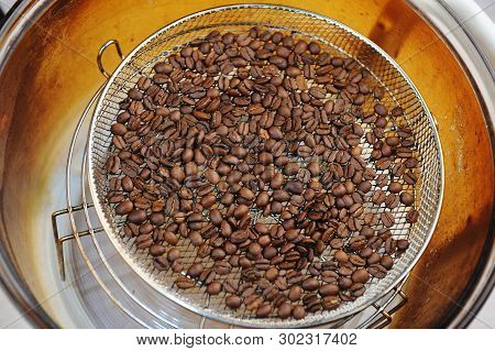 Freshly Roasted Coffee Beans In Aerogrill. Top View. Home Roasting