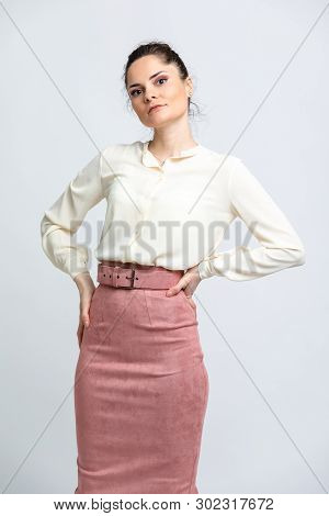 Model In Shirt Of Milk Color, Pink Suede Skirt With Belt, Isolated On White Background.