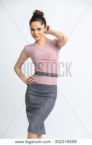 Model In Lilac Blouse, Grey Suede Skirt With Belt, Isolated On White Background.