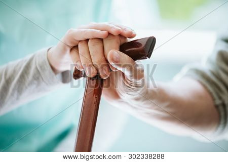 Symbolic Photo With Two Hands - Young Helping Elder One