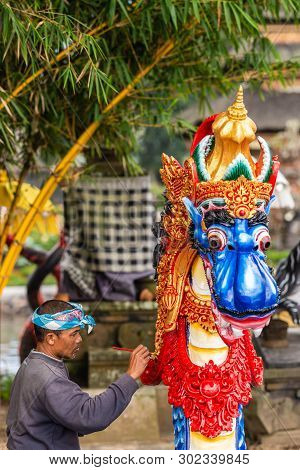 Bali, Indonesia - February 25, 2019: Ulun Danu Beratan Temple Complex In Bedoegoel. Closeup, Man Pai