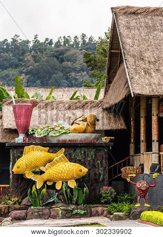 Bali, Indonesia - February 25, 2019: Ulun Danu Beratan Temple Complex In Bedoegoel. Couple Of Golden