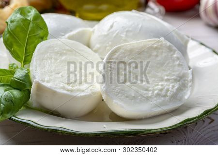 Balls And Pieces Of Buffalo Mozzarella, Soft Italian Scheese Made From The Milk Of Italian Mediterra