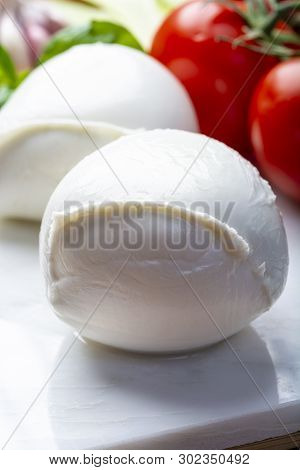 Balls Of Buffalo Mozzarella, Soft Italian Scheese Made From The Milk Of Italian Mediterranean Buffal